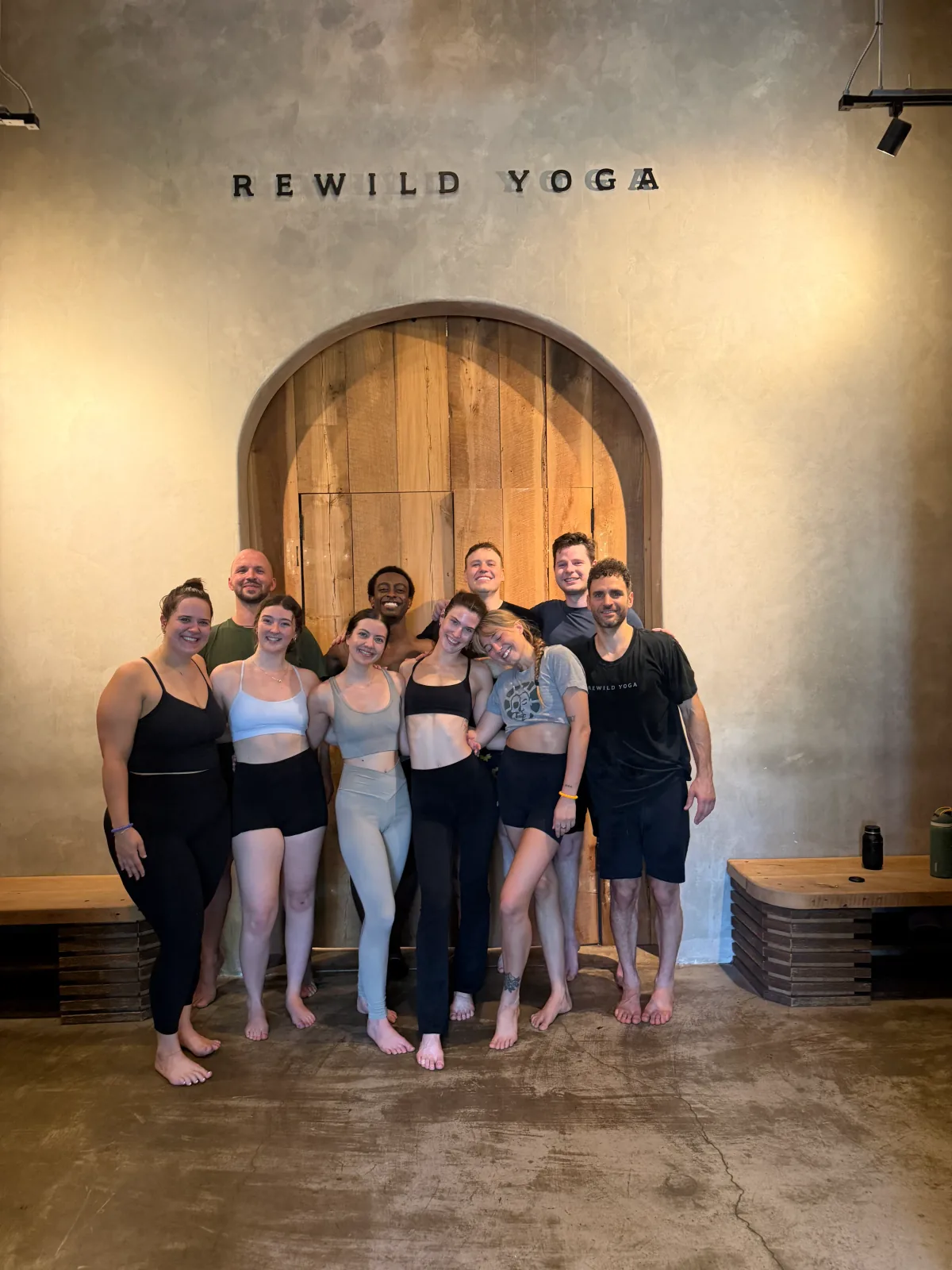 A Be Bad teacher training cohort gathered at REWILD YOGA