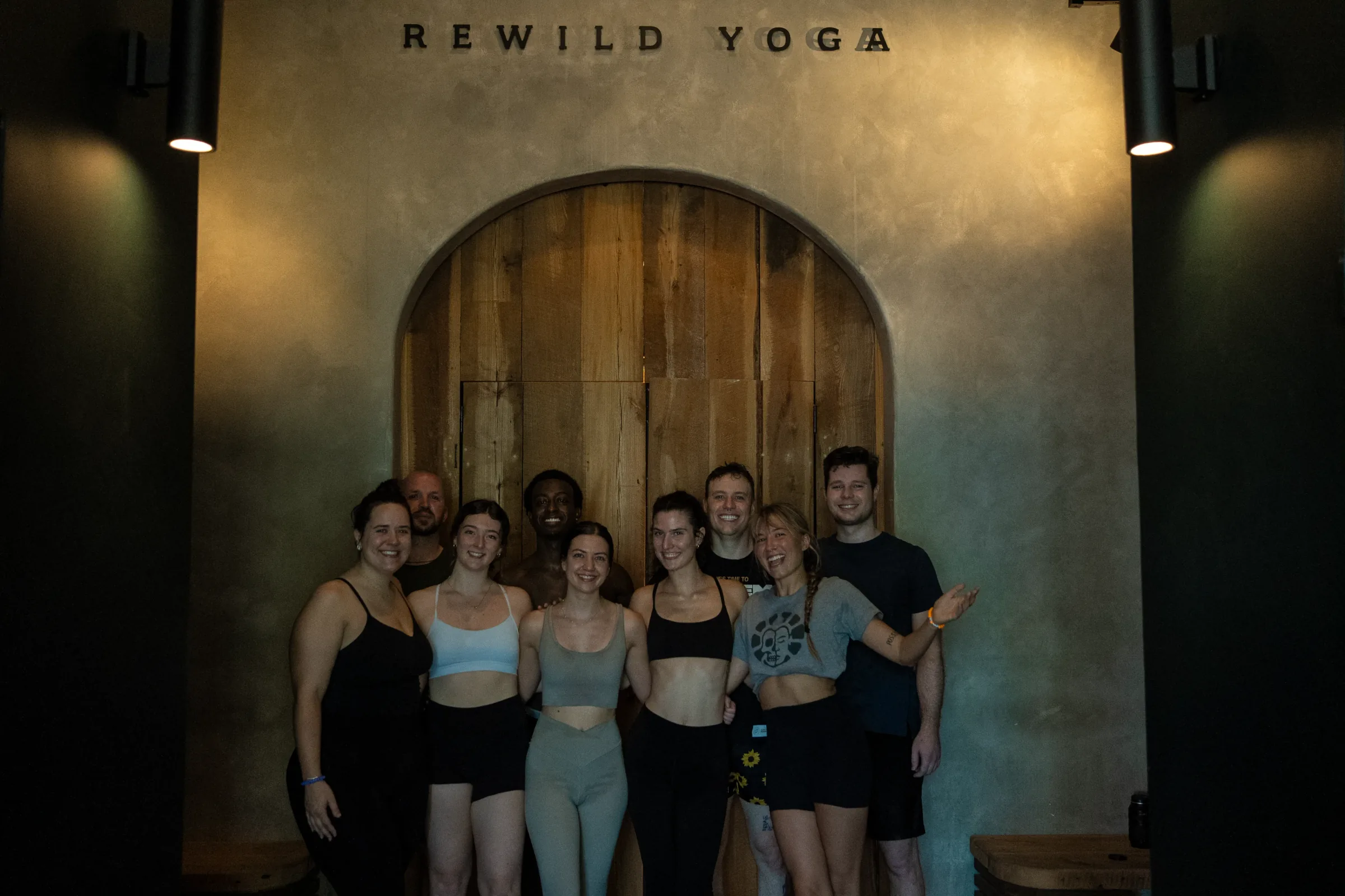 The Be Bad yoga teacher training cohort together inside REWILD YOGA